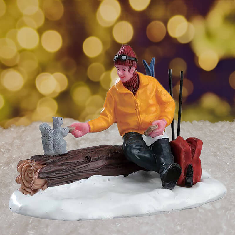 Lemax Christmas Village 'Have A Bite' (Skiier sat on log feeding squirrel)