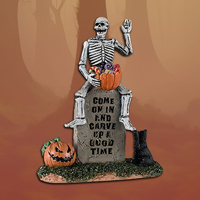 Lemax Halloween ‘Pumpkin Patch Ghoul’ (Skeleton sitting atop a gravestone, holding a pumpkin)